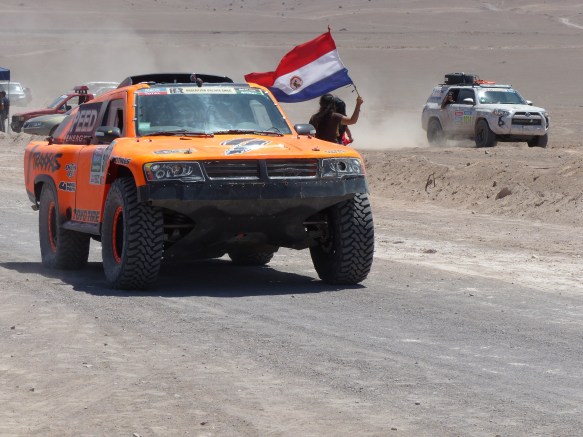 Robbie Gordon arrives first